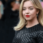 Sydney Sweeney great jeans controversy response, Sydney Sweeney topless behind the scenes photos, Sydney Sweeney The Housemaid press circuit, Sydney Sweeney American Eagle ad backlash, Sydney Sweeney against hate divisiveness quote, Sydney Sweeney Christy boxing biopic flop, Sydney Sweeney Jimmy Fallon Tonight Show appearance, Sydney Sweeney rhinestone Miu Miu gown premiere, Sydney Sweeney Amanda Seyfried friendship press tour, Sydney Sweeney authenticity and resilience 2025