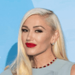 Gwen Stefani sheer tulle ballgown, Gwen Stefani Oh What Fun premiere, Gwen Stefani Vera Wang gown, Gwen Stefani festive holiday fashion, Gwen Stefani corset and tulle dress, Gwen Stefani Christmas style statement, Gwen Stefani Shake the Snowglobe song, Gwen Stefani Blake Shelton breakup rumors, Gwen Stefani red carpet fashion 2025, Gwen Stefani holiday glamour look