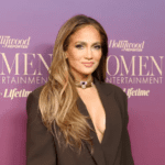 Jennifer Lopez sheer blush crystal netted gown, Jennifer Lopez 168‑carat emerald necklace, Jennifer Lopez Manish Malhotra Inaya collection dress, Jennifer Lopez Udaipur billionaire wedding performance, Jennifer Lopez $2 million wedding performance fee, Jennifer Lopez emerald tikka and earrings look, Jennifer Lopez Swarovski crystal gown India, Jennifer Lopez rose gold glam makeup look, Jennifer Lopez diamond palm cuffs jewelry, Jennifer Lopez regal fashion statement 2025