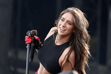 Tate McRae Rolling Stone January 2026 cover, Tate McRae lace lingerie photoshoot, Tate McRae sultry bed pose Rolling Stone, Tate McRae pink string bikini shoot, Tate McRae white bikini red heart trim, Tate McRae Grammy nominee career interview, Tate McRae MTV VMAs raunchy performance, Tate McRae Skims sheer lace bodysuit shoot,