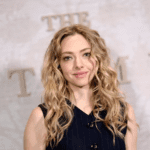 Amanda Seyfried sheer mesh dress premiere look, Amanda Seyfried optical illusion black dress outfit, Amanda Seyfried red carpet fashion 2025, Amanda Seyfried naked dress trend appearance, Amanda Seyfried The Testament of Ann Lee premiere style, Amanda Seyfried bodysuit under sheer dress, Amanda Seyfried Old Hollywood glam hairstyle, Amanda Seyfried fashion moments from movie premieres, Amanda Seyfried and Sydney Sweeney press tour outfits, Amanda Seyfried latest celebrity style inspiration,