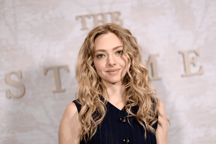 Amanda Seyfried sheer mesh dress premiere look, Amanda Seyfried optical illusion black dress outfit, Amanda Seyfried red carpet fashion 2025, Amanda Seyfried naked dress trend appearance, Amanda Seyfried The Testament of Ann Lee premiere style, Amanda Seyfried bodysuit under sheer dress, Amanda Seyfried Old Hollywood glam hairstyle, Amanda Seyfried fashion moments from movie premieres, Amanda Seyfried and Sydney Sweeney press tour outfits, Amanda Seyfried latest celebrity style inspiration,