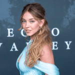 Sydney Sweeney glittering crystal Miu Miu gown, Sydney Sweeney feather boa Old Hollywood look, Sydney Sweeney The Housemaid New York screening, Sydney Sweeney bombshell red carpet style, Sydney Sweeney custom Miu Miu fashion partnership, Sydney Sweeney Amanda Seyfried Gotham red carpet, Sydney Sweeney bouffant hairstyle Glen Oropeza, Sydney Sweeney makeup Melissa Hernandez beauty look, Sydney Sweeney daring fashion evolution 2025, Sydney Sweeney red carpet glamour moments