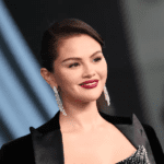 Selena Gomez holiday outfit, Selena Gomez lace trimmed LBD, Selena Gomez Santa hat look, Selena Gomez Christmas décor 2025, Selena Gomez Benny Blanco holiday season, Selena Gomez festive Instagram photos, Selena Gomez semi sheer tights outfit, Selena Gomez Mindy Weiss decorations, Selena Gomez newlywed Christmas, Selena Gomez holiday fashion inspiration