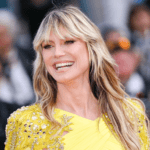 Heidi Klum plunging blazer red carpet look, Heidi Klum risqué slit skirt outfit, Heidi Klum L’Oréal Paris Women of Worth 2025, Heidi Klum festive office siren aesthetic, Heidi Klum daring fashion choices at 52, Heidi Klum topless blazer holiday style, Heidi Klum lace‑trimmed skirt red ensemble, Heidi Klum Calzedonia party tights campaign, Heidi Klum Paris Fashion Week Le Défilé 2025, Heidi Klum monochromatic red carpet glamour