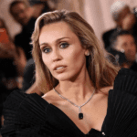 Miley Cyrus Golden Globes 2026, Miley Cyrus one‑shoulder LBD, Miley Cyrus hip‑high slit dress, Miley Cyrus Flowers anniversary, Miley Cyrus Instagram photos 2026, Miley Cyrus Maxx Morando engagement, Miley Cyrus Grammy wins Flowers, Miley Cyrus daring fashion look, Miley Cyrus black sprinter van photos, Miley Cyrus viral Golden Globes outfit