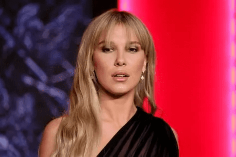 Millie Bobby Brown no‑bra shirt, Millie Bobby Brown Eleven gym outfit, Millie Bobby Brown Stranger Things finale, Millie Bobby Brown Florence by Mills fashion, Millie Bobby Brown Instagram photo dump, Millie Bobby Brown 2025 fashion highlights, Millie Bobby Brown married Jake Bongiovi, Millie Bobby Brown adopted baby girl, Millie Bobby Brown blonde hair look, Millie Bobby Brown cozy loungewear