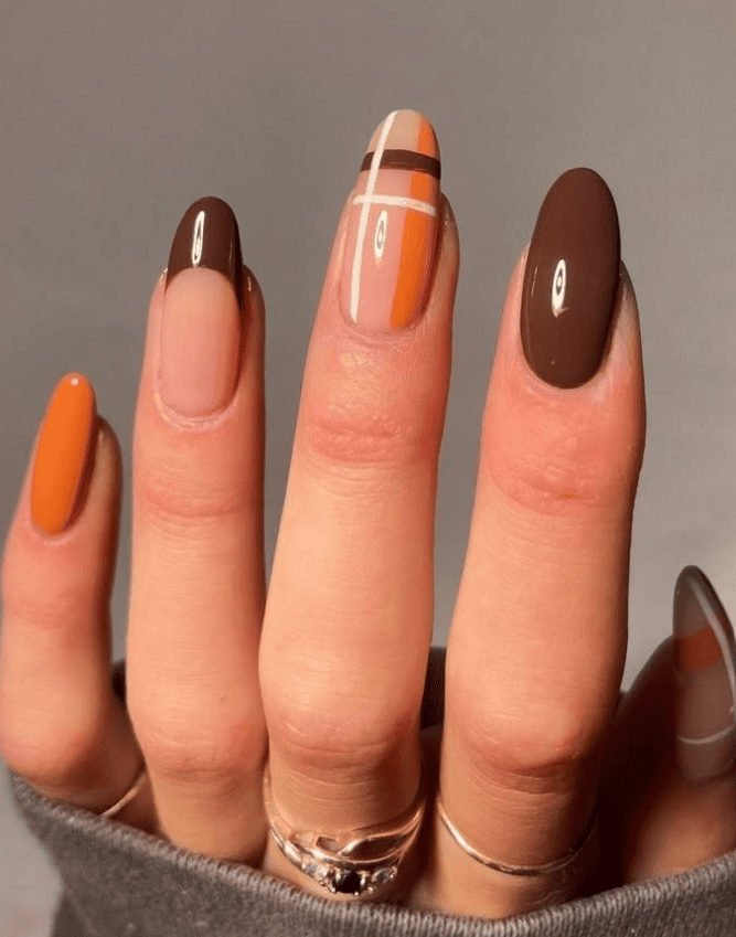 September nail trends 2026, fall nail colors, pumpkin spice nails, burgundy fall nails, chocolate brown manicure, plaid nail designs, caramel glazed nails, olive green nails, tortoiseshell nails, velvet cat eye nails